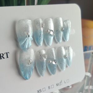 Shell baby blue shimmer silver ombre nails